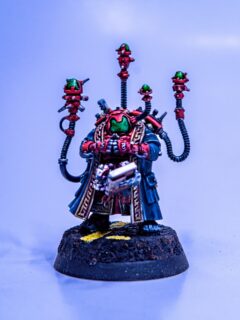 Memnyr Strategist sporting an intimidating professors cradle while playing Regicide on his tablet #leaguesofvotann #wargammer40k #paintingwarhammer40k